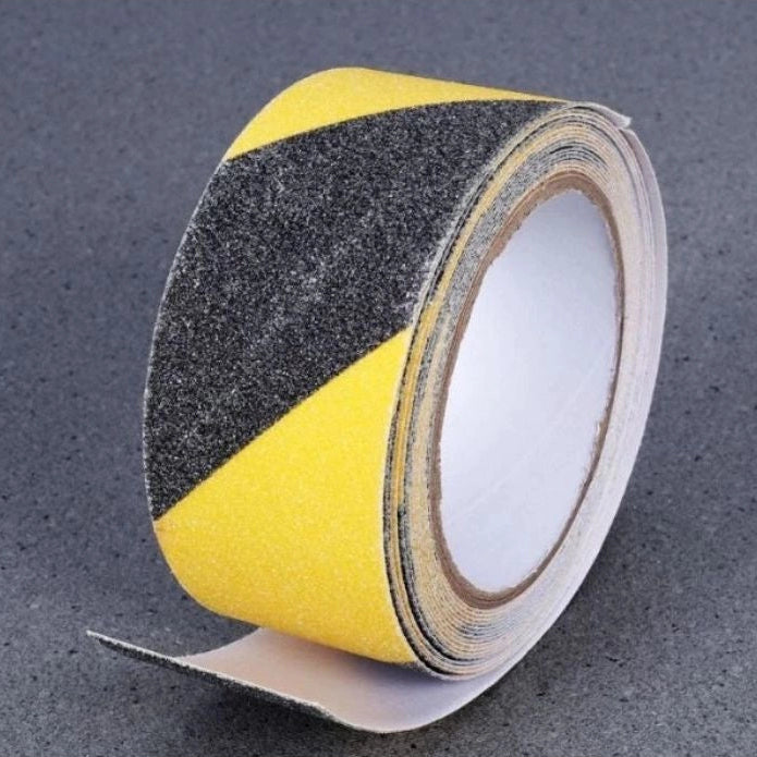 Roll of black and yellow safety tape on a gray background with 'HARDWARE' branding.