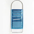 A blue rectangular kitchen tool with a sturdy metal handle at the top, this Techmanistan 3in1 Stainless Steel Vegetable Slicer Chopper Grater features two different grating surfaces: one with larger holes and another with smaller holes.