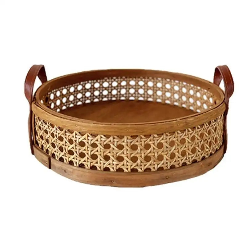 Techmanistan's Hand Woven Round Rattan Baskets feature a wooden base and leather handles. The sides display intricate patterns of interlaced bamboo strips, and the baskets have a natural, rustic appearance. Perfect as part of a handwoven serving trays collection.