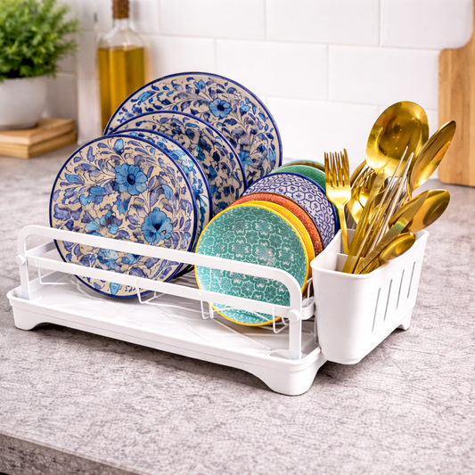 White dish drying rack with plate holder and cutlery basket on kitchen countertop