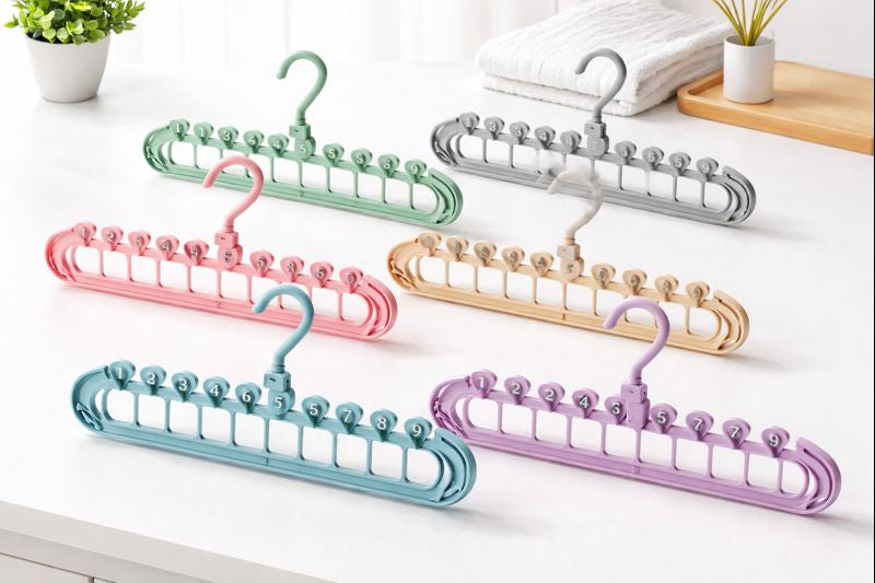 Rotating hook detail on multi-layer space saving hanger for easy wardrobe access