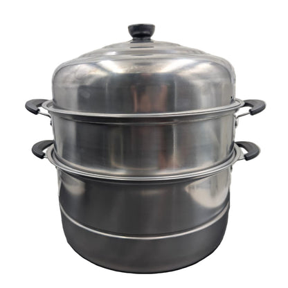 Stainless steel steamer pot on a white background