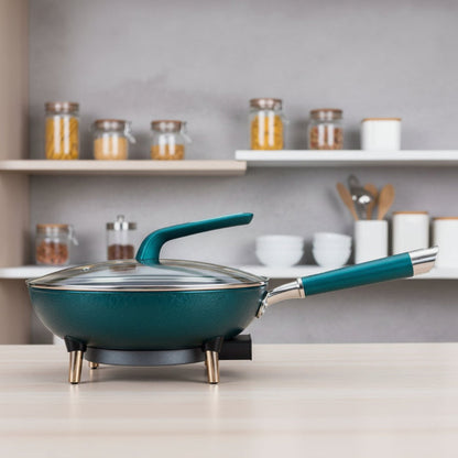 Green electric frying pan with a lid on a blue background