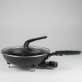 Electric frying pan on a tiled floor