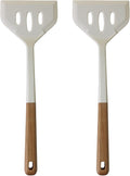 Two white spatulas with wooden handles on a white background